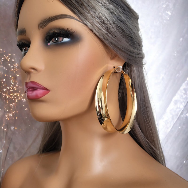 The Jumbo Clear Hoop Earrings in Gold (Clip)