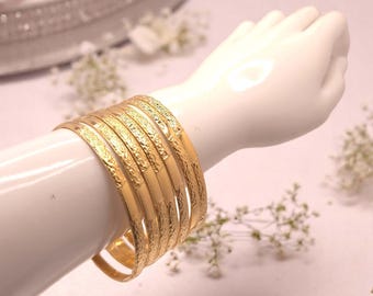 Set of 7 gold colored STAINLESS STEEL shiny wide patterned stacking bangles - set of bangles - large size 68mm diameter - Gold bangle set