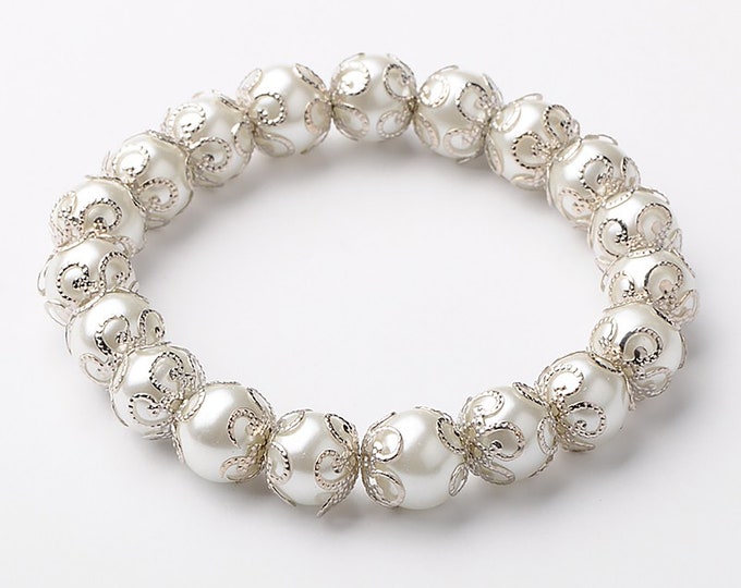Beautiful antique white glass pearl elasticated beaded bracelet with silver bead cap detail