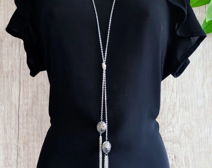 34" long silver tone knotted lariat style necklace with tibetan silver beads & chain tassel detail
