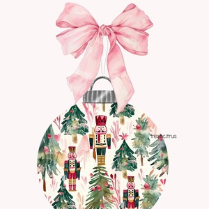 May include: A Christmas ornament with a watercolor design. The ornament features a pattern of green Christmas trees and red nutcrackers on a cream background. A large pink bow is at the top. The text "freshcitrus" is on the right side of the ornament.