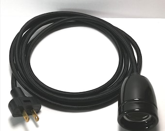 May include: Black electrical cord with a black plug and a black ceramic light socket.