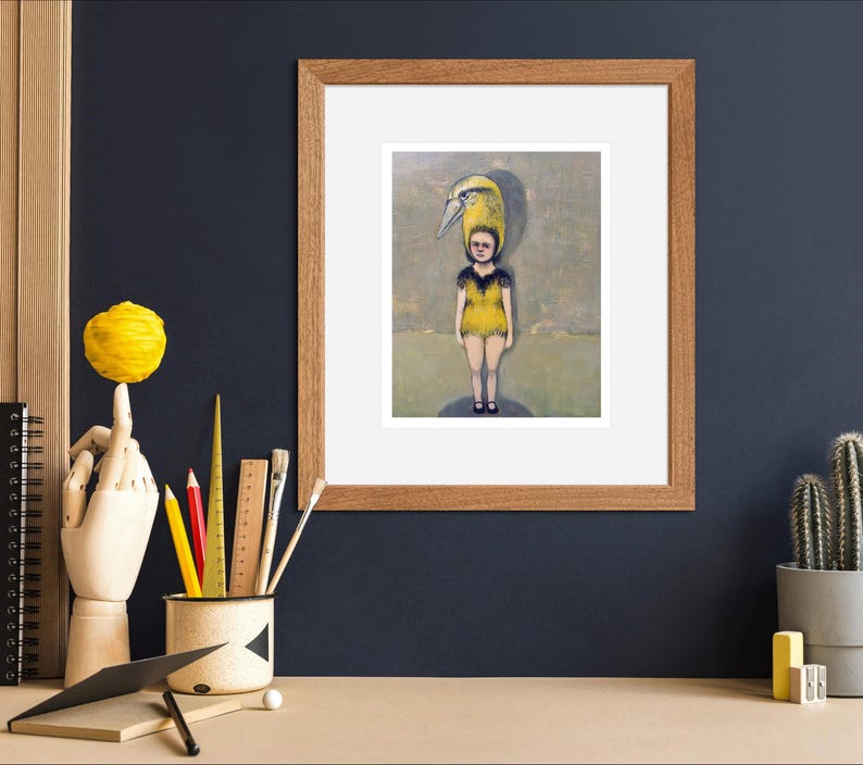 May include: A framed painting of a young person wearing a yellow and black costume with a bird's head. The person is standing on a circular platform in a field.