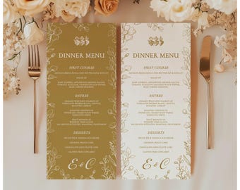 May include: Two wedding dinner menus with floral designs and the text "Dinner Menu." The menus are in gold and white, with a gold fork and knife on either side. The menus list the courses and the initials "E&C."