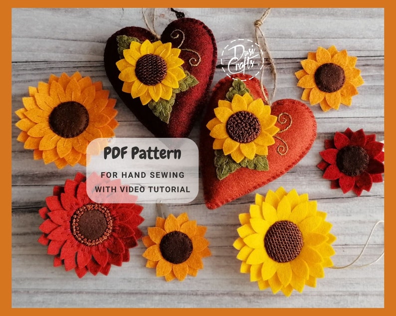 May include: A PDF pattern for hand sewing felt sunflower ornaments. The pattern includes a video tutorial. The image shows a variety of felt sunflowers in different sizes and colours, including red and yellow.