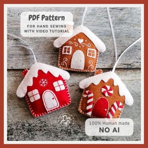 May include: Three felt house ornaments with white hanging strings. One is red with a white roof and snowflake, one is brown with a white roof and swirl details, and one is brown with a white roof, candy canes, and a peppermint candy accent.
