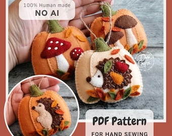 May include: Three felt pumpkin ornaments featuring autumn themes. One displays a red mushroom, another shows brown mushrooms, and the third features a hedgehog with leaves. Each has a green stem and twine loop. Text reads 100% Human made NO AI and PDF Pattern FOR HAND SEWING.
