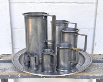 pewter measuring tankards by Axel Hasselstrom in Denmark 1890-1940