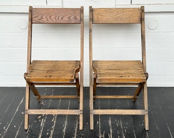 2 oak folding chairs ~ wood folding chairs ~ marked Stockdale Vol Fire Co & MK  ~ authentic mid century wooden folding chairs