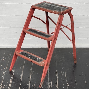 vintage step stool ~ worn red metal stool ~ nicely distressed red metal step stool ~ plant stand ~ good color ~ farmhouse antiques