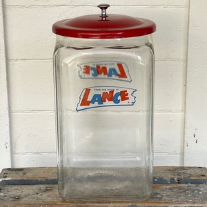 Sold at Auction: Large Glass Lance Jar w/Metal Lid