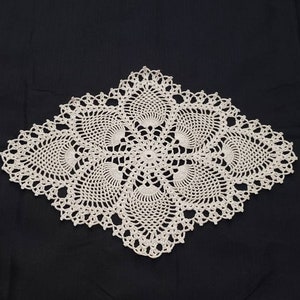 Crocheted vintage style oval pineapple doily