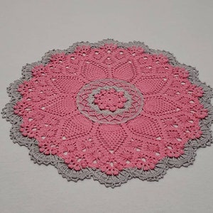 Crocheted round pink pineapple song doily for table and living room decorations