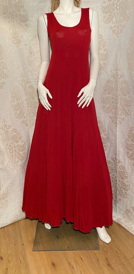 Long, red base dress.