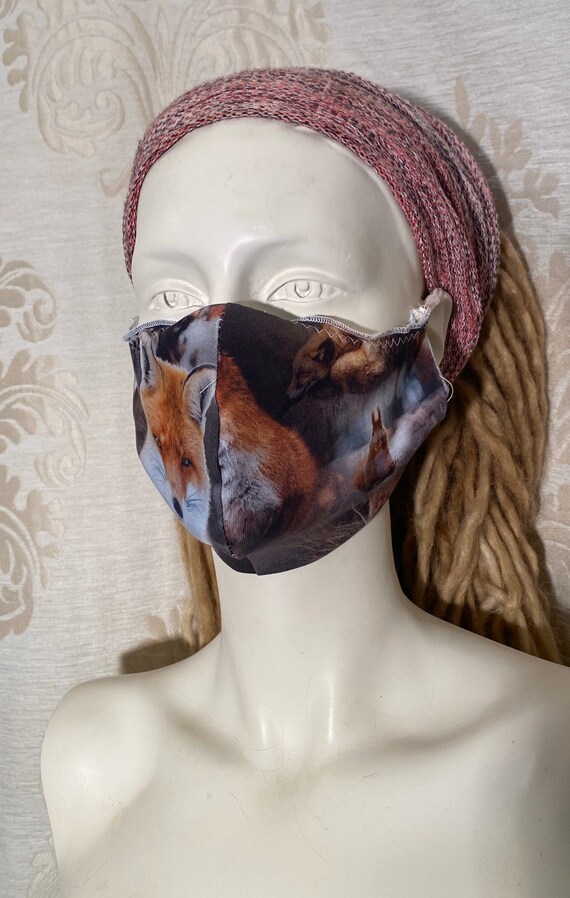 Mouthcaps (2 pieces) with fox print and elastic cord.