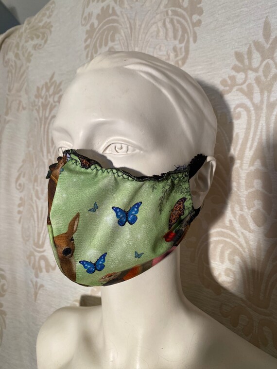 Mouthcaps (2 pieces) with fairy print and elastic cord.