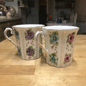 Pair of handpainted retro 1970s mugs