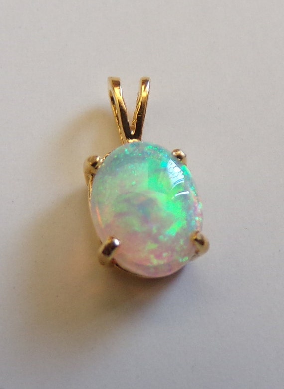 14k gold opal pendant  reds blues greens 10x 9mm