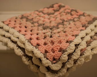 Crochet textured granny style baby blanket pink