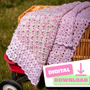 May include: A handmade, crocheted baby blanket in shades of lavender, pink, and green. The blanket features a textured, bobble stitch design and a scalloped edge. The blanket is folded over a wicker basket, with a digital download graphic in the corner.