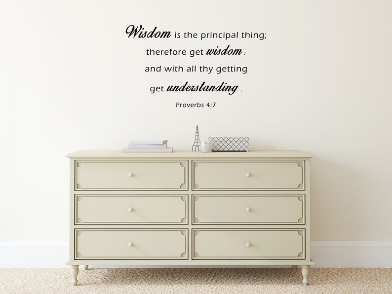 May include: A white dresser with six drawers and a black quote on the wall above it that reads "Wisdom is the principal thing; therefore get wisdom: and with all thy getting get understanding. Proverbs 4:7"