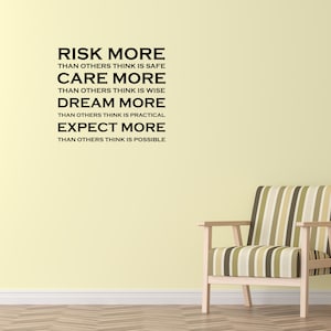 May include: A motivational quote on a light yellow wall with a striped armchair and a side table with a plant. The quote reads: "Risk more than others think is safe. Care more than others think is wise. Dream more than others think is practical. Expect more than others think is possible."