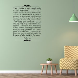 May include: Black and white text on a light green wall, with the words "The Lord is my shepherd; I shall not want." The text is a quote from Psalm 23 of the Bible. The wall is decorated with a green lampshade, a yellow and brown patterned armchair, and a small wooden table with a potted plant.