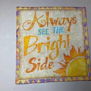 11” square bright, motivational phrase wall hanging or table topper
