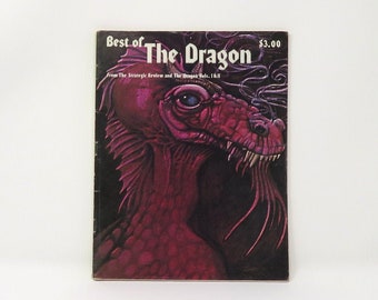 Può includere: Una copertina di rivista vintage con un drago rosso con un occhio blu. La copertina recita "Best of The Dragon" e "$3.00".