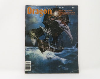 Può includere: Una copertina di rivista Dragon vintage che mostra un dirigibile blu scuro e bianco che naviga su un mare tempestoso. La rivista è il numero 91 e costa $ 3,00. Il testo sulla copertina recita "La morte è arrivata!" e "Sistema magico di alto livello!"