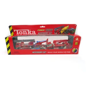May include: A Tonka Power Trax Accessory Set in a red and yellow box. The set includes several toy vehicles: a fire truck, a helicopter, and a crane truck. The box reads "Emergency" and "Build Your World of Fun!"