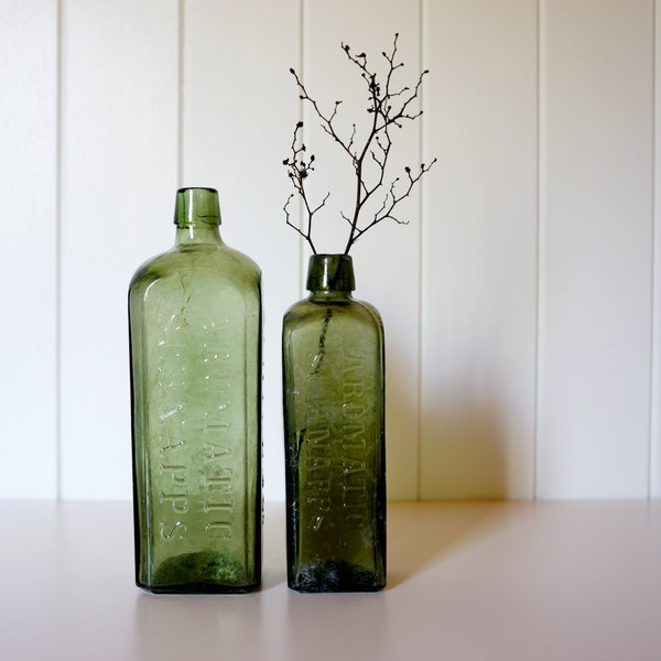 RESERVED for ANNE-MARIE ~ Pair of olive green Udolpho Wolfe's Aromatic Schnappes bottles