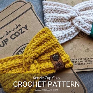May include: Two crocheted cup cozies, one in yellow and one in white, with a brown leather tag and a green tag that says "Spread Love". The cozies are on a brown paper background with the text "handmade cup cozy" and "Kenzie Cup Cozy CROCHET PATTERN WWW.DENIMADE.COM".