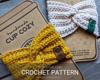 May include: Two crocheted cup cozies, one in yellow and one in white, with a brown leather tag and a green tag that says "Spread Love". The cozies are on a brown paper background with the text "handmade cup cozy" and "Kenzie Cup Cozy CROCHET PATTERN WWW.DENIMADE.COM".
