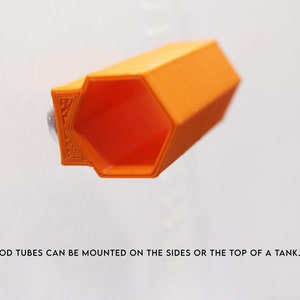 May include: Orange plastic hexagonal tube with a smooth surface. SPOOD TUBES CAN BE MOUNTED ON THE SIDES OR THE TOP OF A TANK.