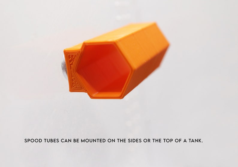 May include: Orange plastic hexagonal tube with a smooth surface. SPOOD TUBES CAN BE MOUNTED ON THE SIDES OR THE TOP OF A TANK.