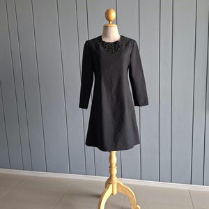 70s little black dress We only have a-few size XS pieces left in our Black and Gold Medieval Mini Dress once they're gone they're gone! #70s #the70s #fashion #retro #vintage #70sstyle