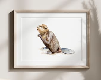 May include: Watercolor print of a beaver in a wooden frame. The artwork depicts a brown beaver with a flat tail, standing upright. The print is displayed on a neutral-colored wall, with a wooden chair and decorative dried plants in the foreground.