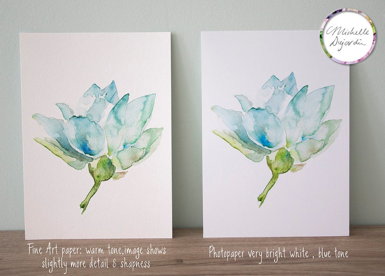 May include: Two watercolour paintings of a blue flower on white paper. The painting on the left is on fine art paper with a warm tone. The painting on the right is on photo paper with a very bright white background.