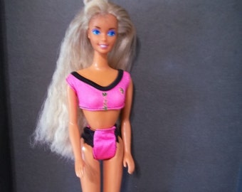 Beach Blast Barbie wearing her original Pink and Black Two Piece Swim Suit #3237 by Mattel 1989 with visor and frisbee