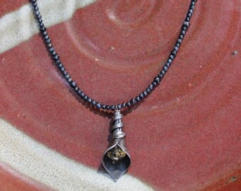 Forged Iron Calla lily with faceted citrine on 18" dark grey/peacock blue freshwater pearls