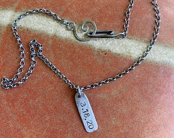 Date stamped pendant on oxidized sterling silver chain