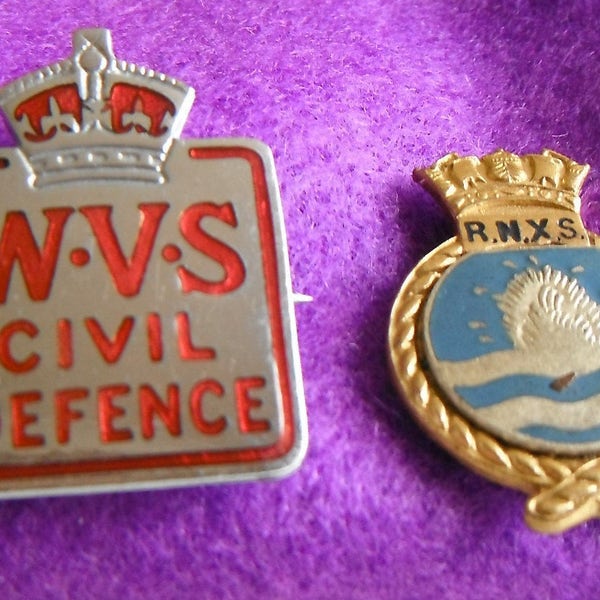 Two vintage lapel/hat badges from WW2