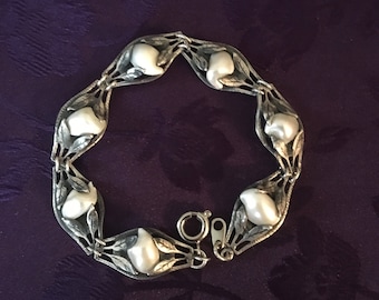 This bangle is very detailed and exquisite. Childs vintage embossed bangle with safety chain rare find