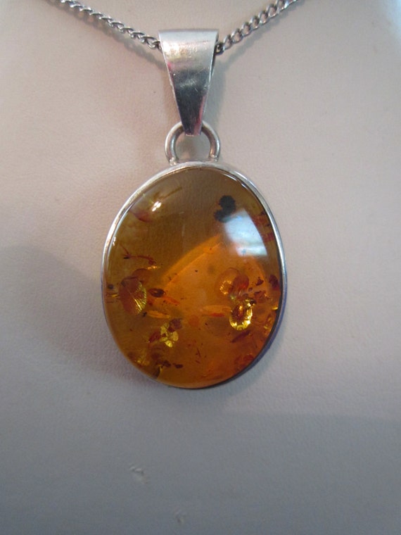 Amber and sterling silver pendant - bezel set exqu