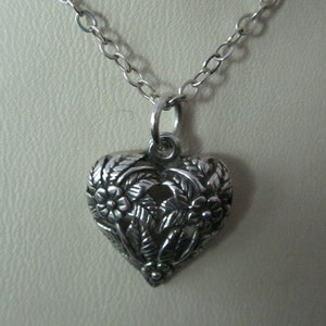 Heart necklace / pendant detailed with flowers
