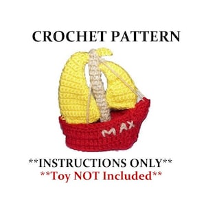 Pode incluir: Padrão de crochê para um veleiro vermelho e amarelo com o nome "Max" no lado. Apenas instruções, brinquedo não incluído.