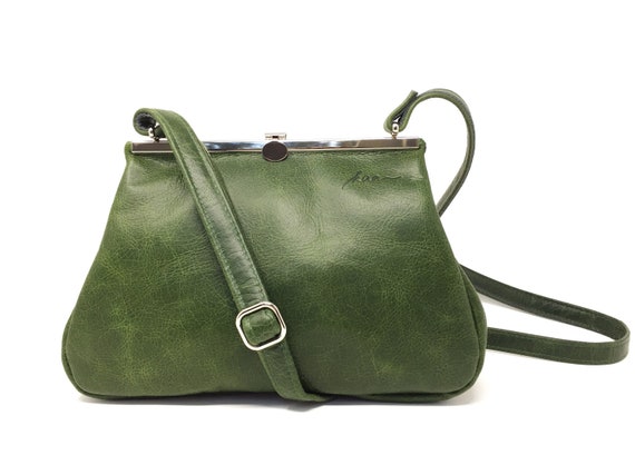 green leather bag with metal closure