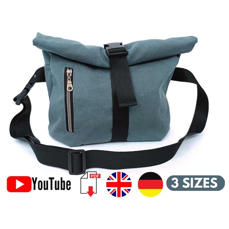 May include: A teal canvas messenger bag with a black adjustable shoulder strap and a black buckle closure. The bag has a zippered front pocket and a roll-top design. The image includes the YouTube logo, a PDF download icon, a British flag, a German flag, and the text "3 SIZES."