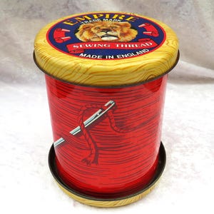 Vintage Silver Crane Empire sewing tin:  1970s cotton reel tin